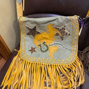 Beautiful custom made purse, large pocket, lots of fringe one of a kind!